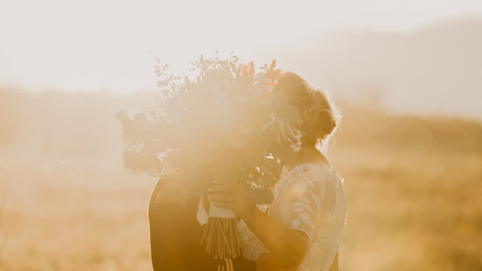 Intimate outdoor elopement ceremony with mountain backdrop