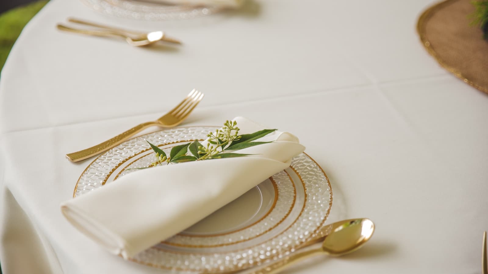 Elegant wedding reception table setup with place cards and floral centerpiece